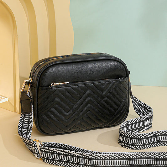 Quilted crossbody bag with front pocket