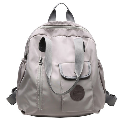 Soft backpack with flap and drawstring closure