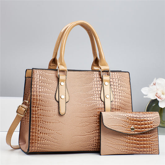 Embossed handbag with matching pouch