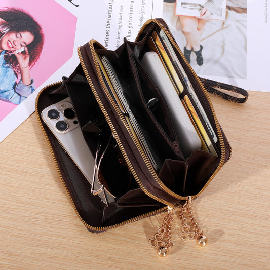 Patterned zip-around wallet with wrist strap