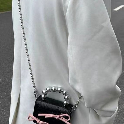 Mini handbag with bow and beaded handle